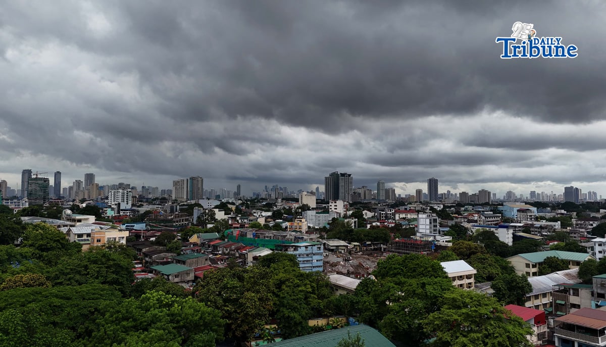 Dark clouds loom over Metro Manila and nearby provinces on Monday as Typhoon Domeng (Jangmi) continues to enhance the southwest monsoon, bringing rains to parts of the country. PAGASA said the storm may exit the Philippine Area of Responsibility by Monday night. | Photo by Analy Labor
