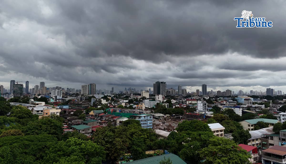 Dark clouds loom over Metro Manila and nearby provinces on Monday as Typhoon Domeng (Jangmi) continues to enhance the southwest monsoon, bringing rains to parts of the country. PAGASA said the storm may exit the Philippine Area of Responsibility by Monday night. | Photo by Analy Labor