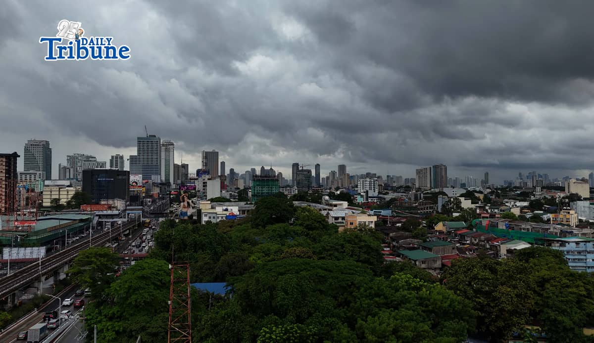 Dark clouds loom over Metro Manila and nearby provinces on Monday as Typhoon Domeng (Jangmi) continues to enhance the southwest monsoon, bringing rains to parts of the country. PAGASA said the storm may exit the Philippine Area of Responsibility by Monday night. | Photo by Analy Labor