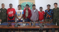 Seven communist rebels wave white flag