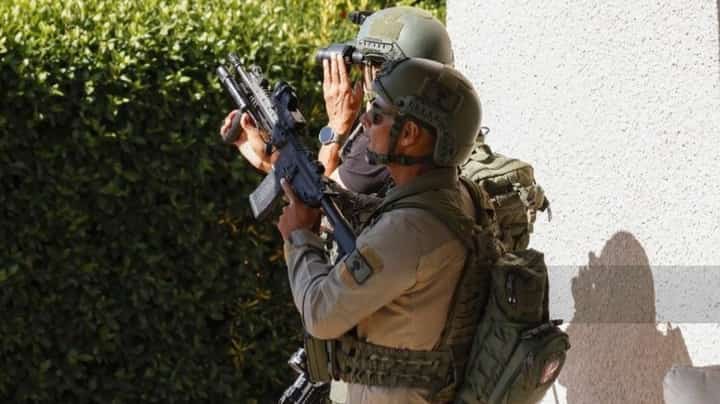 ISRAELI soldiers react after taking cover near the Israel-Lebanon border following a Hezbollah drone attack over the northern border.