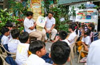 President Ferdinand Marcos Jr. and DepEd Secretary Sonny Angara read the Filipino children's book "Ang Pagong at ang Matsing" to students of Kapitbahayan Elementary School in Navotas City on Tuesday.