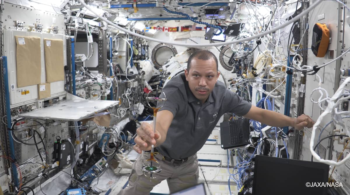NASA astronaut Christopher Williams performs the Double Gyroscope experiment as part of the Asian Try Zero-G on the International Space Station (ISS). Photo courtesy of JAXA/NASA.