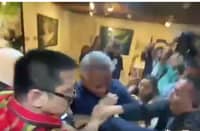 SUITCASE smackdown Series of photos captures the scuffle between Interior and Local Government Secretary Jonvic Remulla (in blue shirt) and Senator Robin Padilla (in striped red shirt) before the start of the Blue Ribbon Committee hearing on the testimonies of 18 Marines who witnessed the distribution of cash-filled suitcases in the Floodgate scandal.