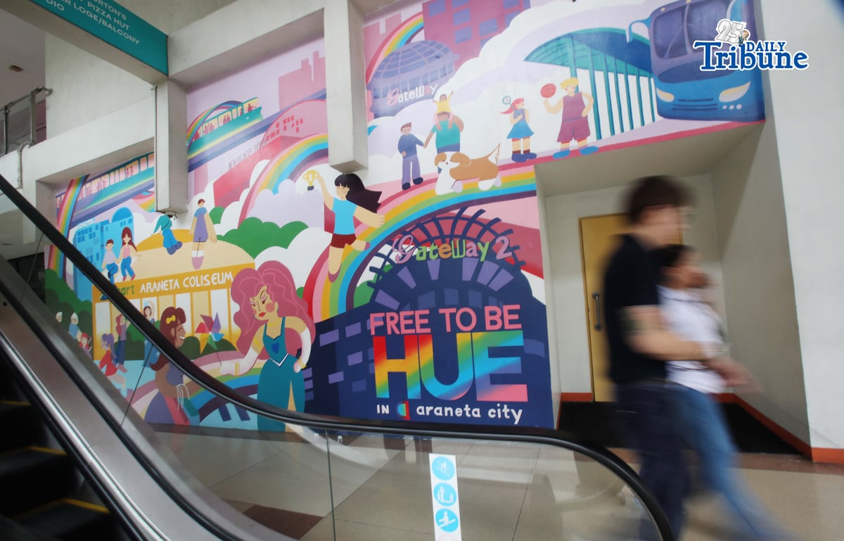 (June 05 2026) Pedestrians walk past the Mural titled “Free to be HUE” at Araneta City in Cubao Quezon City, on Friday June 5 2026. The mural stands as a symbolic and lasting expression of Araneta City’s commitment to inclusivity, acceptance, and self-expression, honoring the LGBTQIA+ community as the celebration of Pride Month starts. Photo/Analy Labor