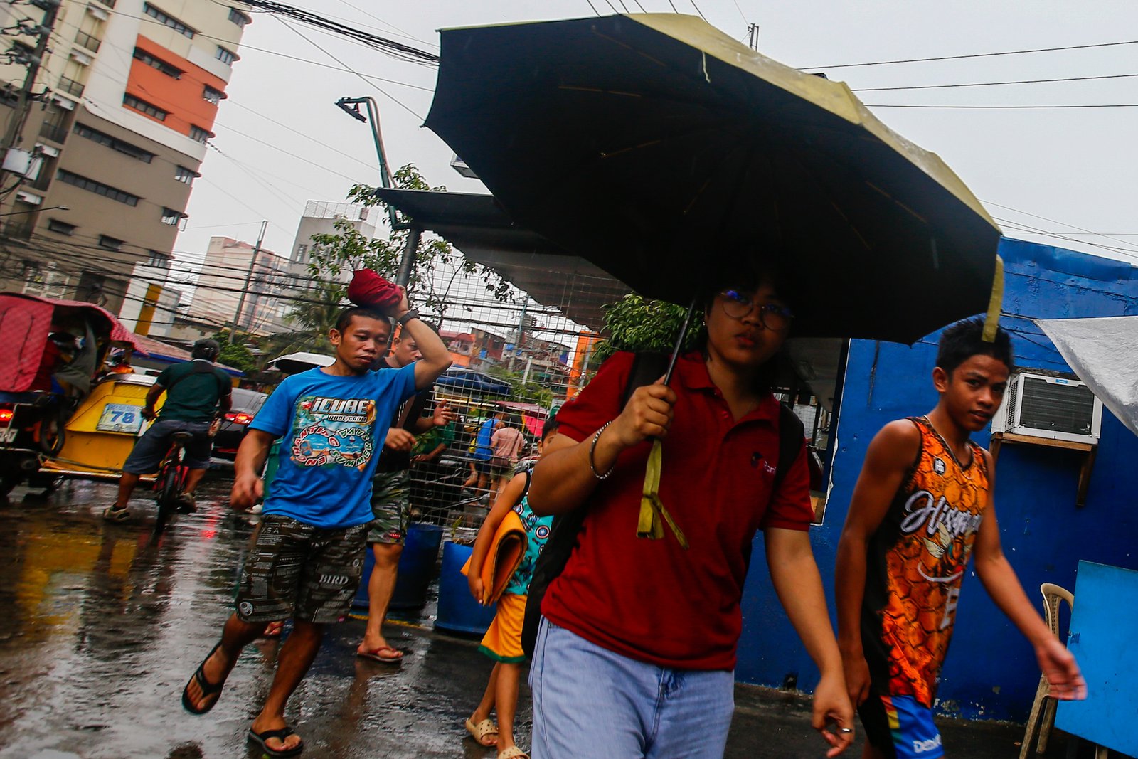 Motorists and commuters in Divisoria, Manila brave intermittent rains brought by Tropical Depression Ester, which has enhanced the southwest monsoon. The downpour comes shortly after PAGASA officially declared the start of the rainy season.