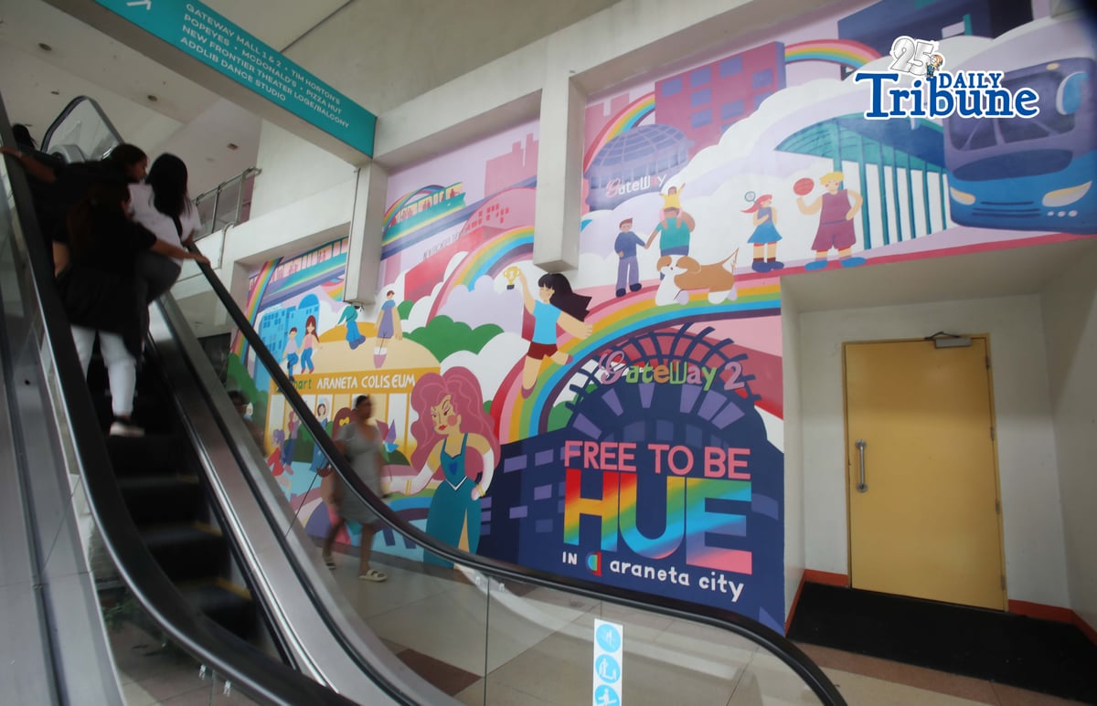 (June 05 2026) Pedestrians walk past the Mural titled “Free to be HUE” at Araneta City in Cubao Quezon City, on Friday June 5 2026. The mural stands as a symbolic and lasting expression of Araneta City’s commitment to inclusivity, acceptance, and self-expression, honoring the LGBTQIA+ community as the celebration of Pride Month starts. Photo/Analy Labor