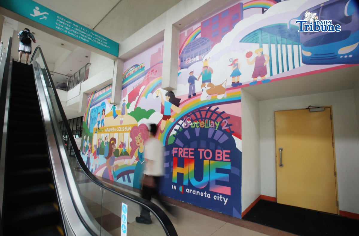 (June 05 2026) Pedestrians walk past the Mural titled “Free to be HUE” at Araneta City in Cubao Quezon City, on Friday June 5 2026. The mural stands as a symbolic and lasting expression of Araneta City’s commitment to inclusivity, acceptance, and self-expression, honoring the LGBTQIA+ community as the celebration of Pride Month starts. Photo/Analy Labor
