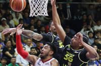 RJ Abarrientos of Barangay Ginebra gets smothered by TNT Tropang 5G defenders during Game 2 of their PBA Season 50 Commissioner’s Cup best-of-seven finals series last Friday. The Tropang 5G won, 101-94.