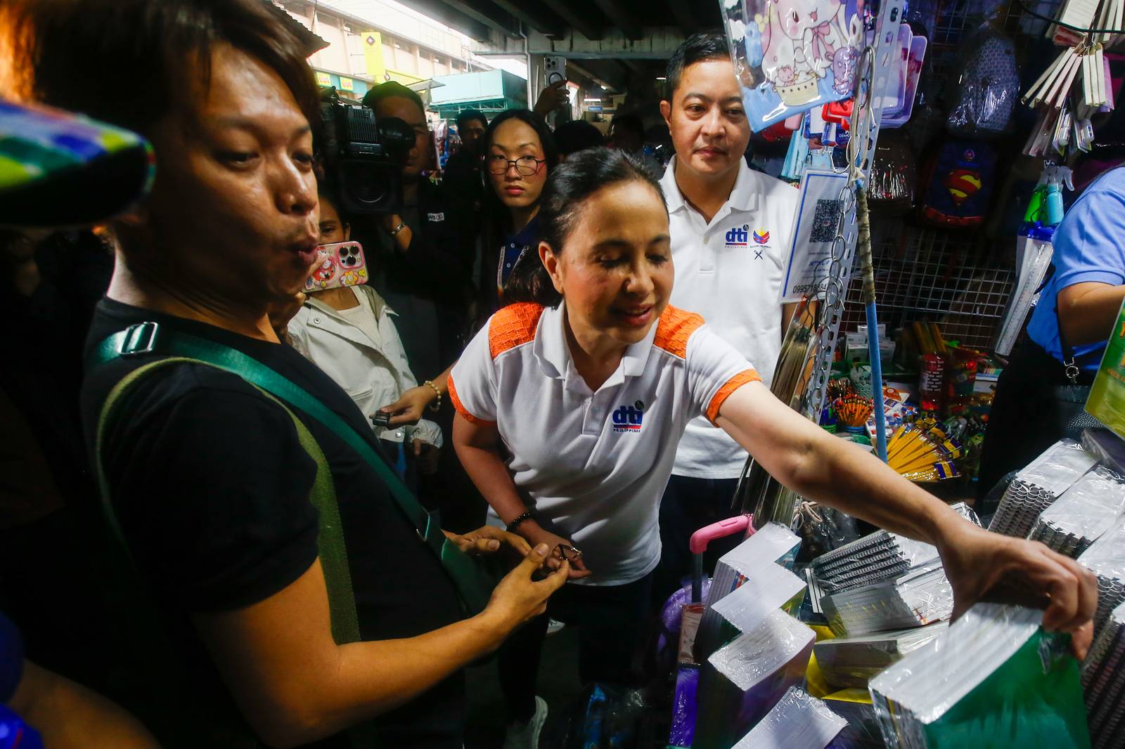 Department of Trade and Industry (DTI) Secretary Ma. Cristina Roque inspects school supplies during a price and supply monitoring operation at Taft Avenue Extension in Pasay City on 06 June 2026. Secretary Roque reported that local retailers are strictly complying with the agency's suggested retail prices (SRP) ahead of the upcoming school year, with some vendors even selling goods below the SRP to ease the financial burden on consumers.
