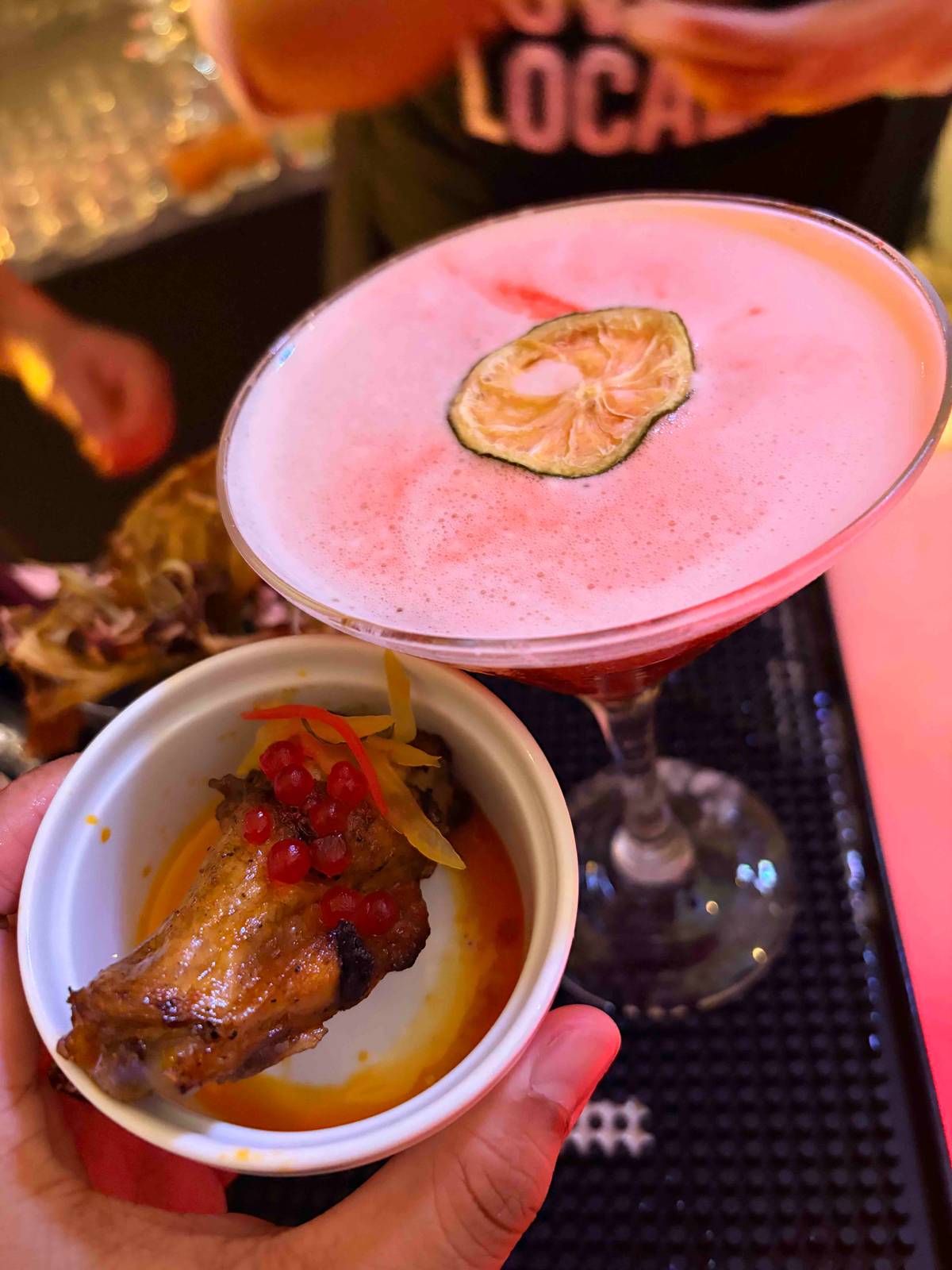 THE Afterglow cocktail pairs perfectly with savory inasal chicken for a satisfying combination of flavors..