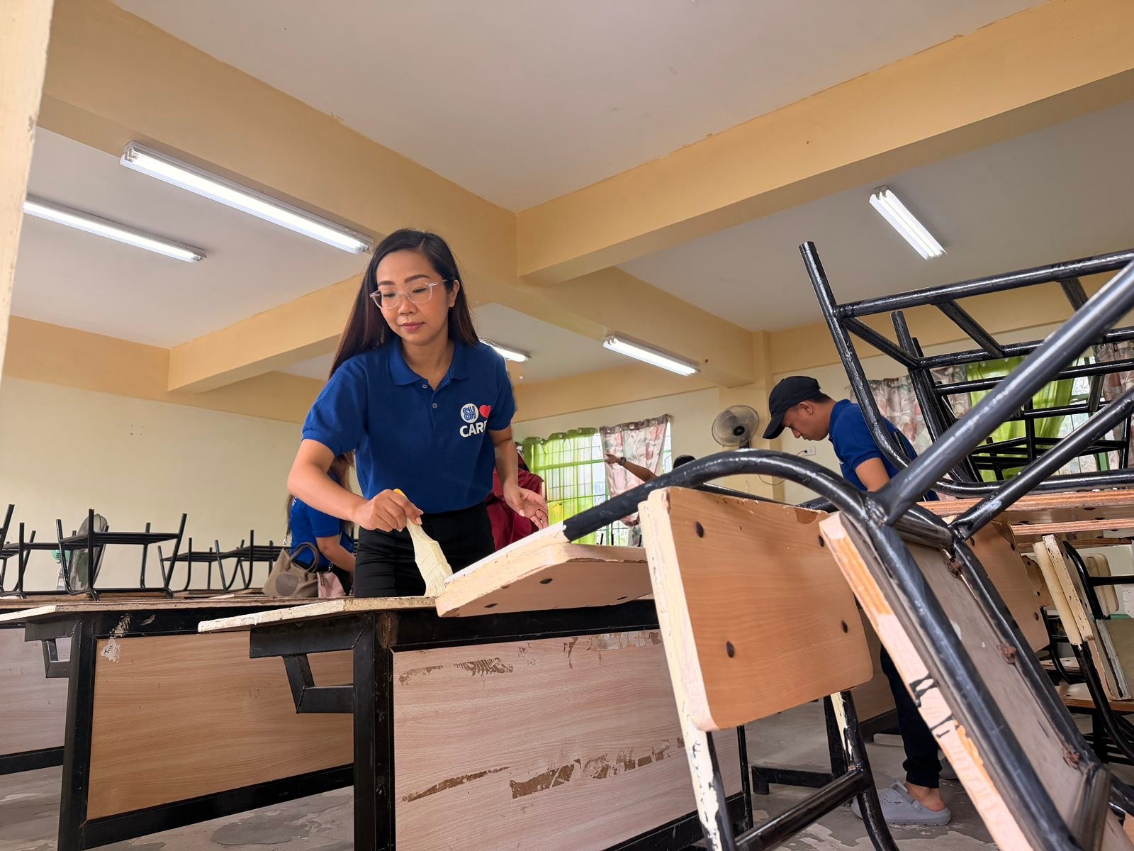 SM City La Union employees brave rain for Brigada Eskwela 2026