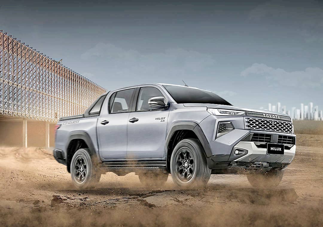 CONQUEST shows the diesel-powered Hilux with its rugged front bumper and updated exterior design.