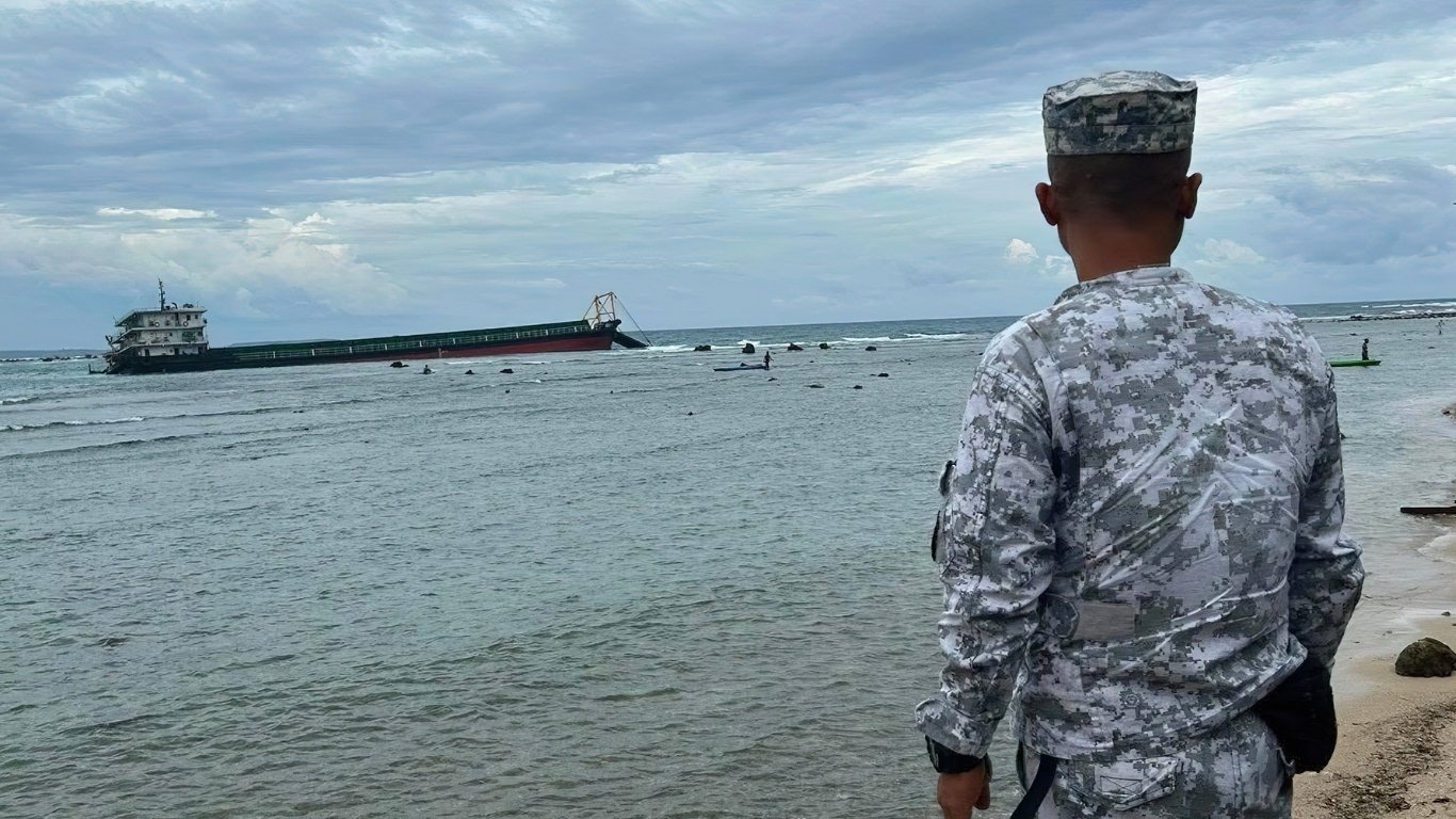 Stormy weather forces cargo ship aground