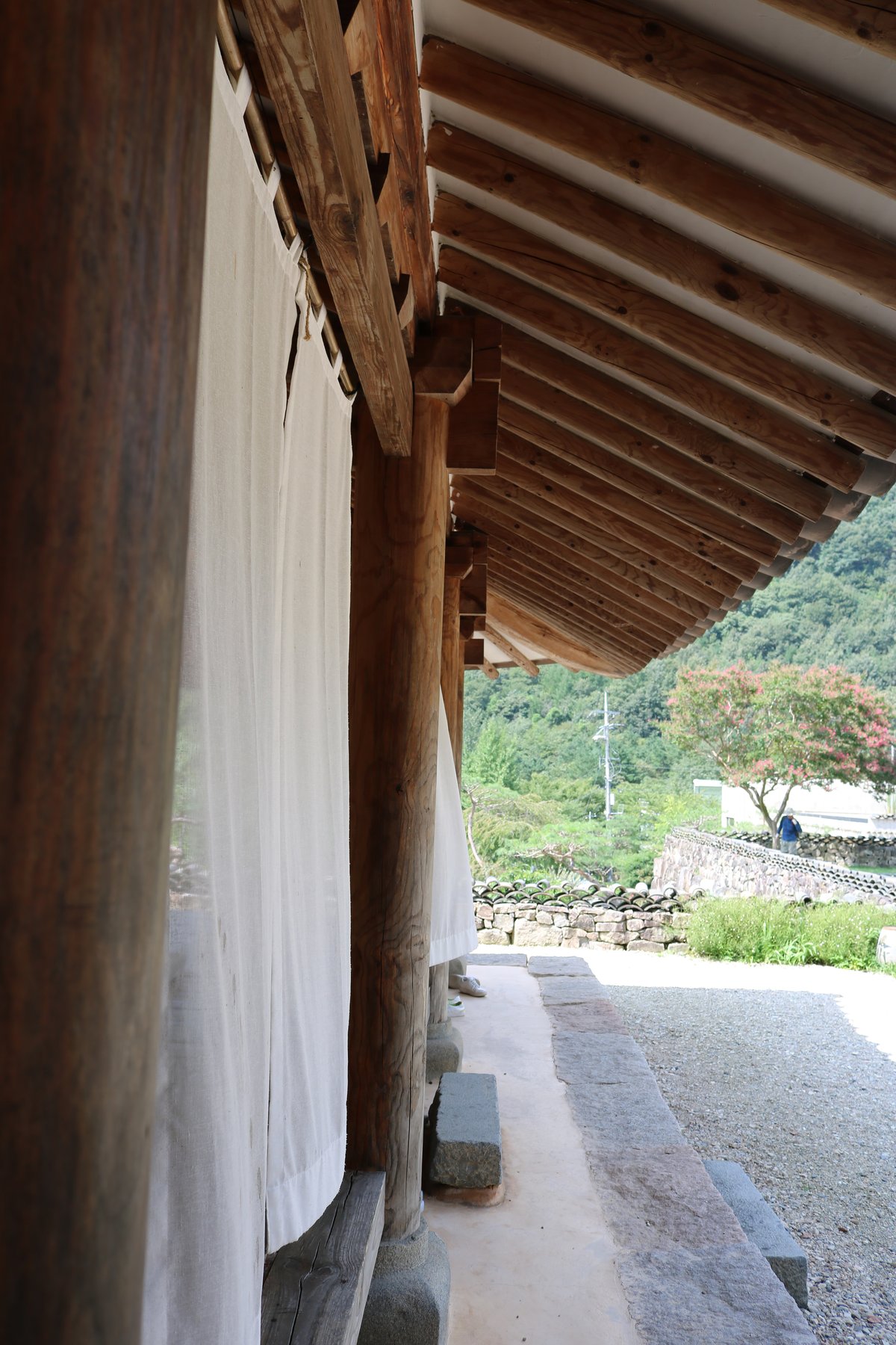 TIMBER beams, stone paths and tiled roofs preserve the elegance of Joseon-era design in a modern setting.