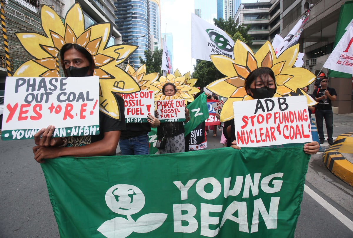 Civil society organizations, led by the NGO Forum on ADB and the Nuclear Free Bataan Movement, stage a creative protest to denounce the Asian Development Bank's role in deepening the global energy crisis. The groups protested the bank's continued fossil fuel financing, extractive investments, and false climate solutions outside the ADB office in Mandaluyong City on Wednesday, June 10, 2026. The demonstrators unveiled a giant "Kraken of destruction" to symbolize what they call the bank's system of energy capture. | Photo by Analy Labor