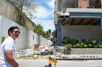 Marcos hands out cash aid as quake death toll climbs