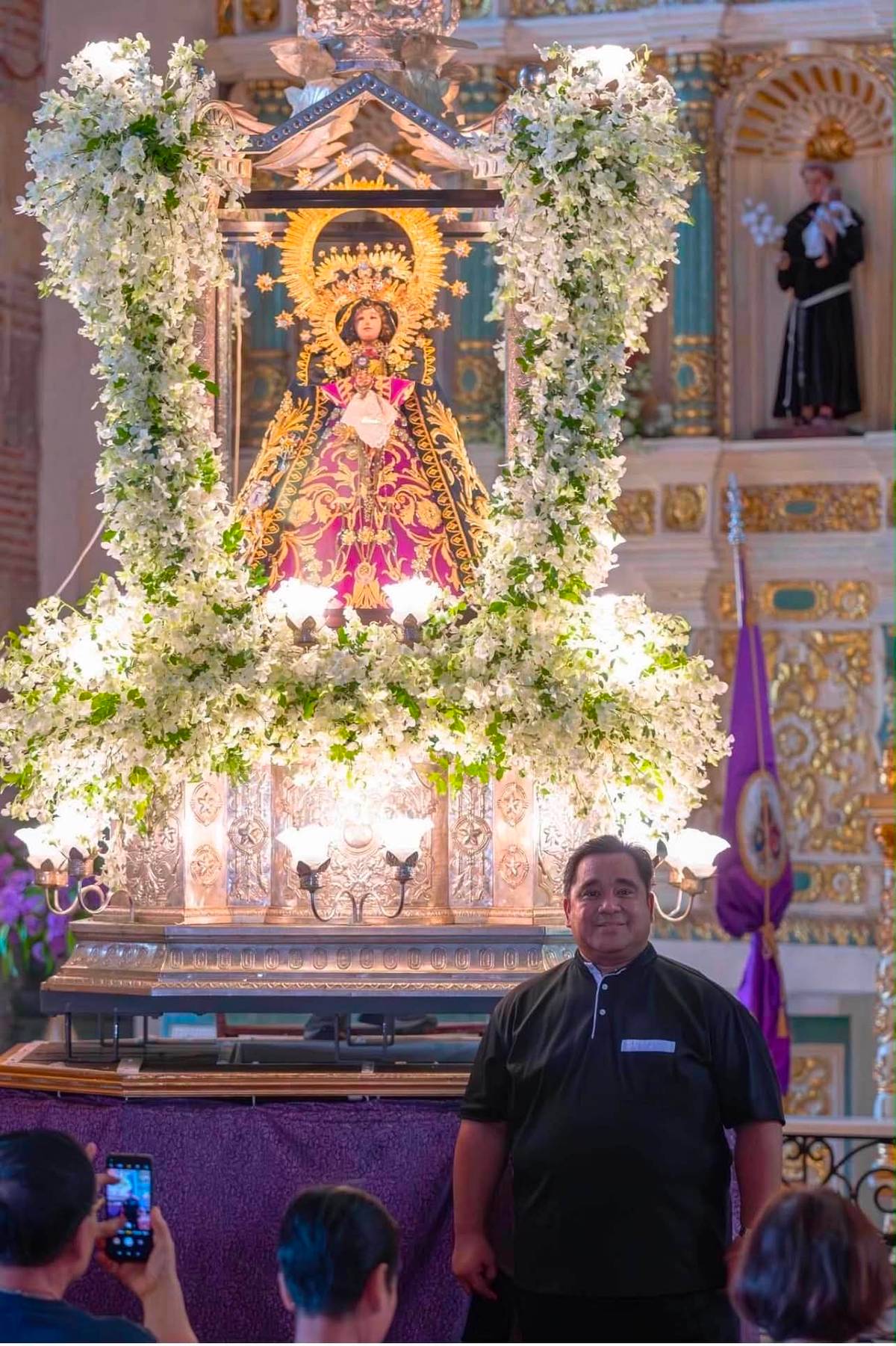 A sacred moment unfolds as the faithful participate in a special Marian devotion.