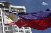(June 11 2026) Philippine Flag waving, while the construction workers busy working at the top of the ongoing construction building in Quezon City, ahead of the observance of the Philippine Independence Day. Photo/Analy Labor