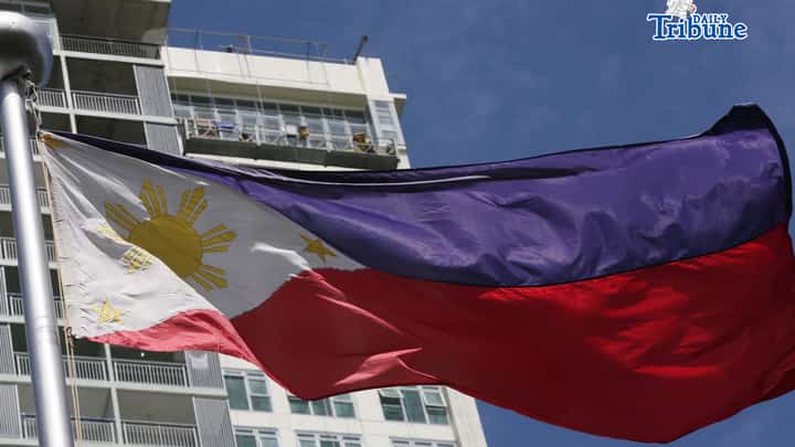 (June 11 2026) Philippine Flag waving, while the construction workers busy working at the top of the ongoing construction building in Quezon City, ahead of the observance of the Philippine Independence Day. Photo/Analy Labor