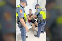 A National Police Commission employee is arrested by Quezon City police after allegedly drawing a firearm and threatening a TNVS driver during a road rage incident in Mandaluyong City.