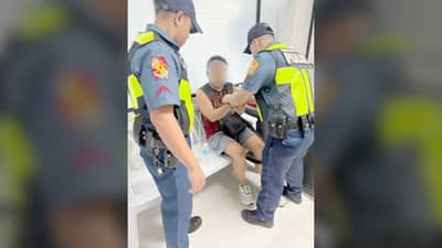 A National Police Commission employee is arrested by Quezon City police after allegedly drawing a firearm and threatening a TNVS driver during a road rage incident in Mandaluyong City.