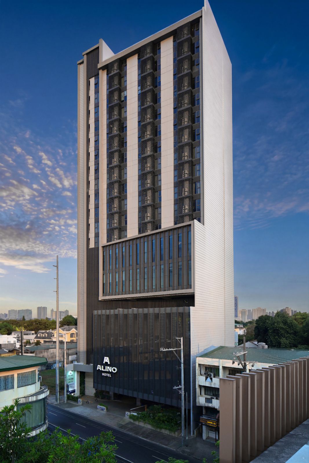 STANDING tall: Alino Hotel rises above the busy streets of Quezon City.