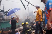 FIRE officials and local authorities assess the destruction in Ato Side and Sitio Pinaglabanan, Barangay Western Bicutan, Taguig City, following a massive fire that displaced approximately 200 families.