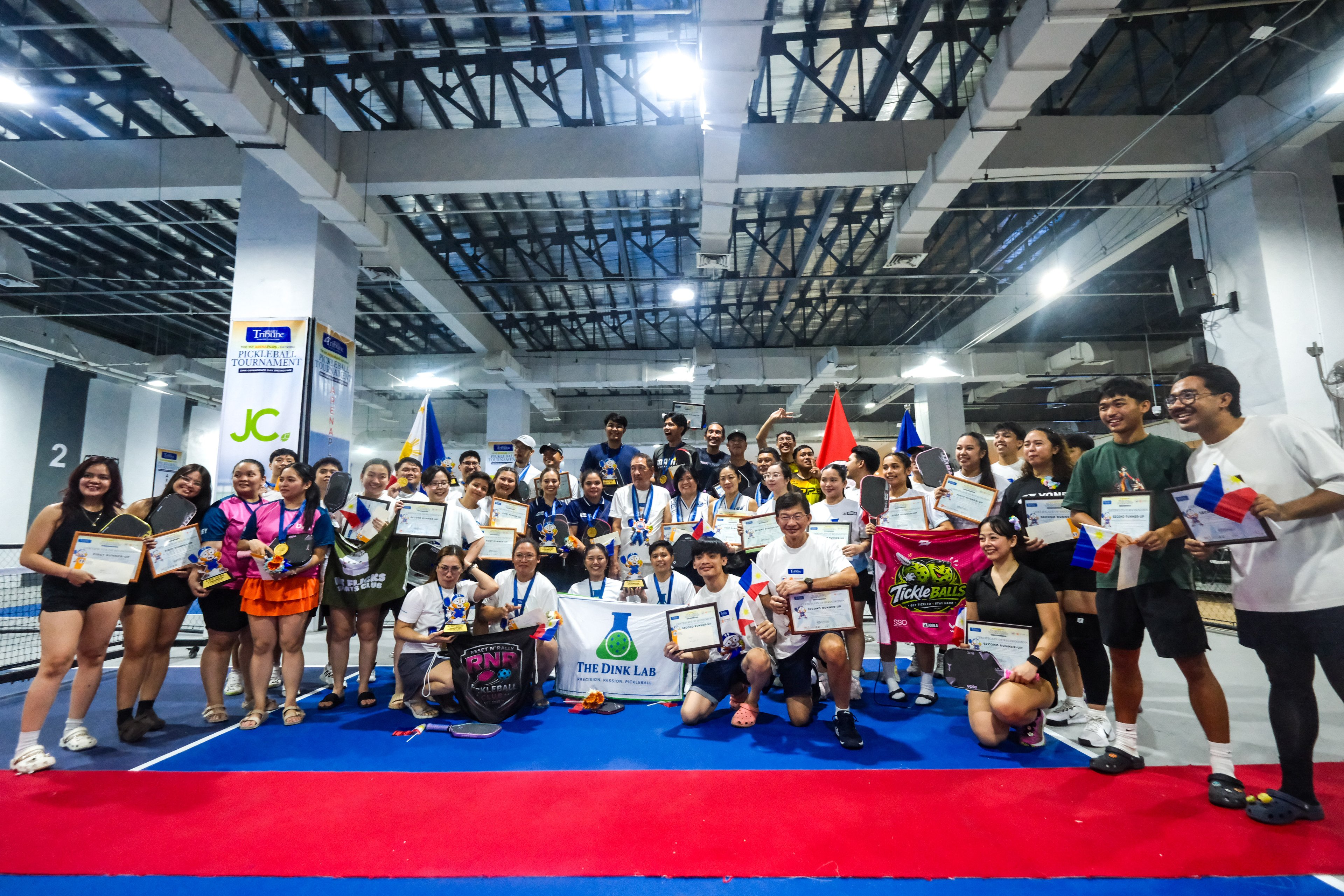 WINNING competitors beam with pride following the memorable staging of the 1st ArenaPlus-KaTribu Pickleball Tournament last Friday at the Dink Lab Elite in Kawit, Cavite.