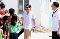 PRESIDENT Marcos Jr. and Secretary Aliling interact with beneficiaries of Pasinaya Homes, a horizontal housing project in Pampanga under the Expanded 4PH