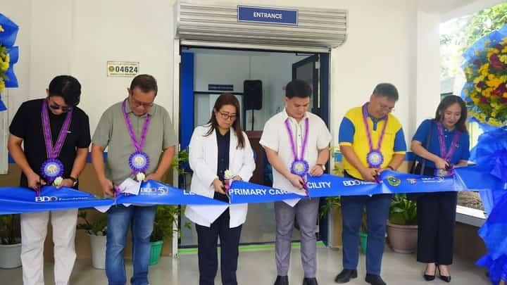 LEGANES Primary Care Facility OIC Dr. Michelle Jaen Krafft and BDO Network Bank branch head Marco Hugolino Casiple (center), lead the ceremonial ribbon cutting for the upgraded LPCF in Poblacion, Leganes, Iloilo on 11 June 2026.