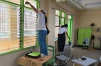 VOLUNTEERS repaint a classroom of Nagkaisang Nayon Elementary School in Quezon City.