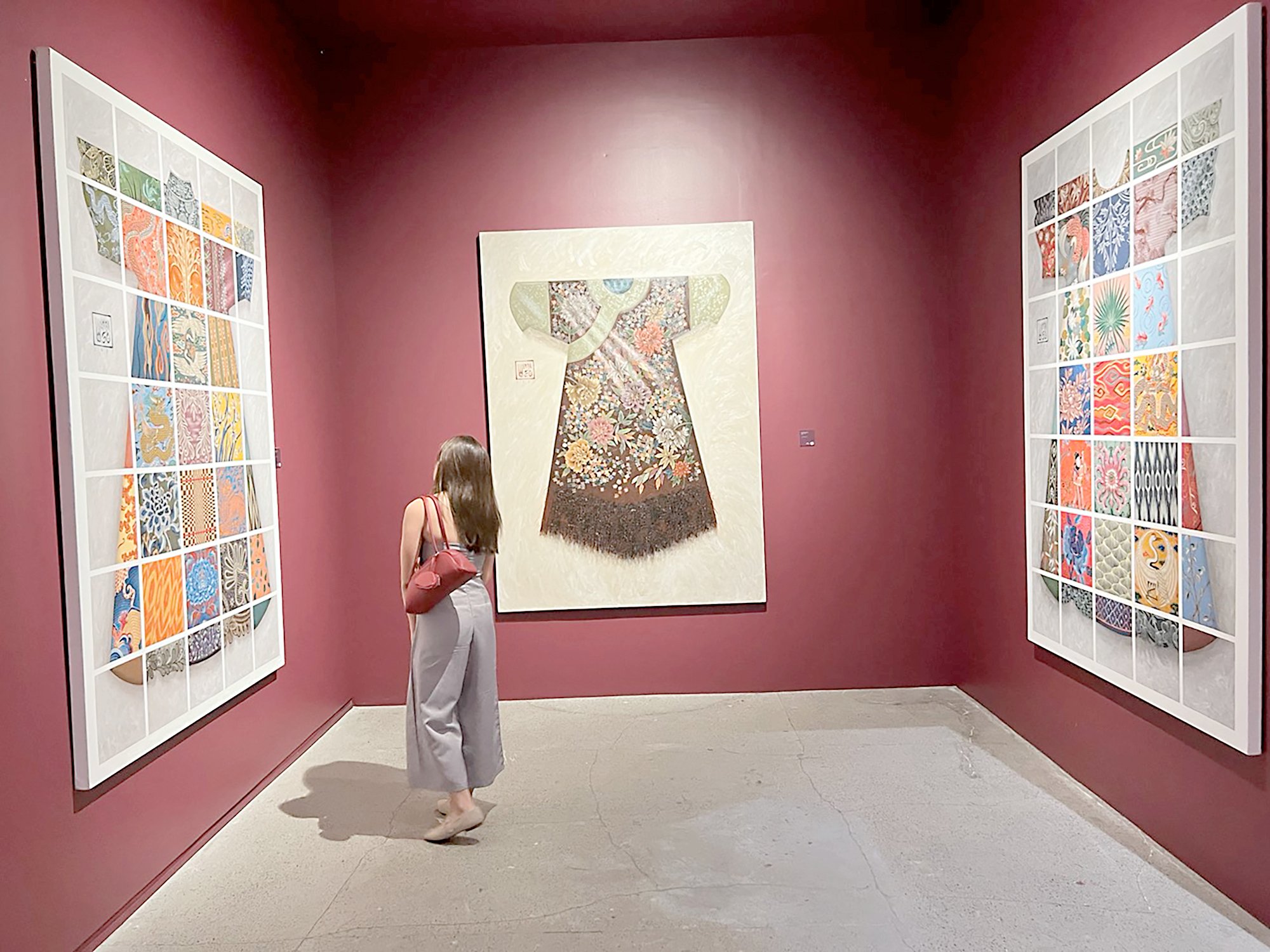 A MUSEUM lover admires a distinct trio of artworks.