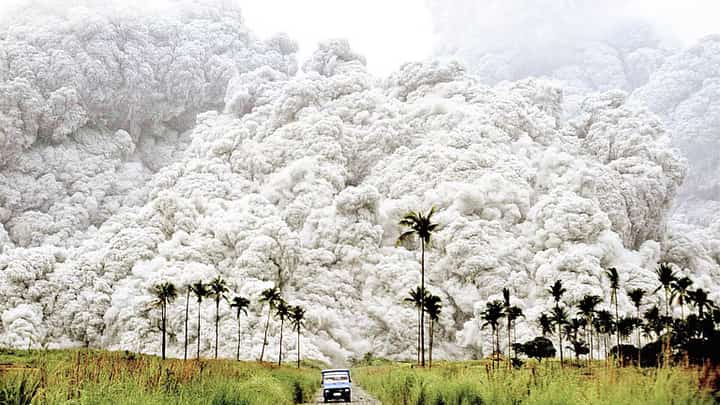 Mount Pinatubo released pyroclastic materials while a blue vehicle outran a deadly, cauliflower-like ash cloud within the danger zone in Botolan, Zambales, early in the morning of June 15, 1991. The photo, captured by a Filipino photographer, won the 1992 World Press Photo Award in Amsterdam under the Nature category and was later included in TIME Magazine’s list of the “Greatest Images of the 20th Century” as well as National Geographic’s “100 Best Pictures of the 20th Century.” (Photo courtesy of Alberto Garcia).