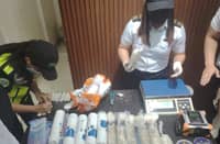 AUTHORITIES from the Ninoy Aquino International Airport Inter-Agency Drug Interdiction Task Group inspect 14 abandoned inbound parcels containing suspected illegal drugs intercepted at the Central Mail Exchange Center in Pasay City. The joint operation was conducted by the Philippine National Police, Bureau of Customs and Philippine Drug Enforcement Agency.