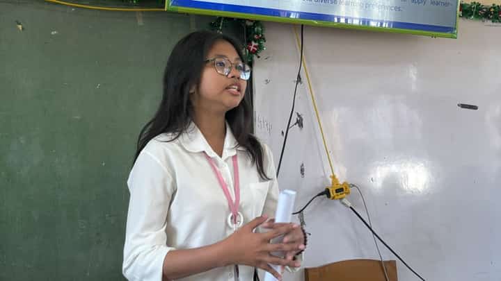 AYESHA Denize Biong presenting and defending a research project in a demonstration of strong communication skills, critical thinking and confidence in sharing her work in March 2026 in Andres Bonifacio Integrated School, Mandaluyong City.