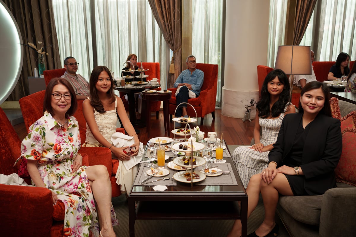 KATHERINE Palomera her grandchildren Maya and Luna, and Raffles Residences manager Kathrine Artienda.