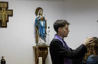 SELF-PROCLAIMED priest, not recognized by the Catholic Church, Francisco Marques, 27, places his hands on a woman’s forehead, during a ‘exorcist retreat’ where he claims to cast out demons afflicting his followers, organized by the Prelature of Saints Peter and Paul in Fatima on 30 May 2026.