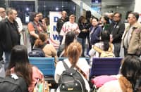 DFA officials welcome the first batch of Filipinos freed by Russia.