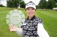 MIYU Yamashita poses with the trophy after winning the Meijer LPGA Classic For Simply Give 2026 at Blythefield Country Club.