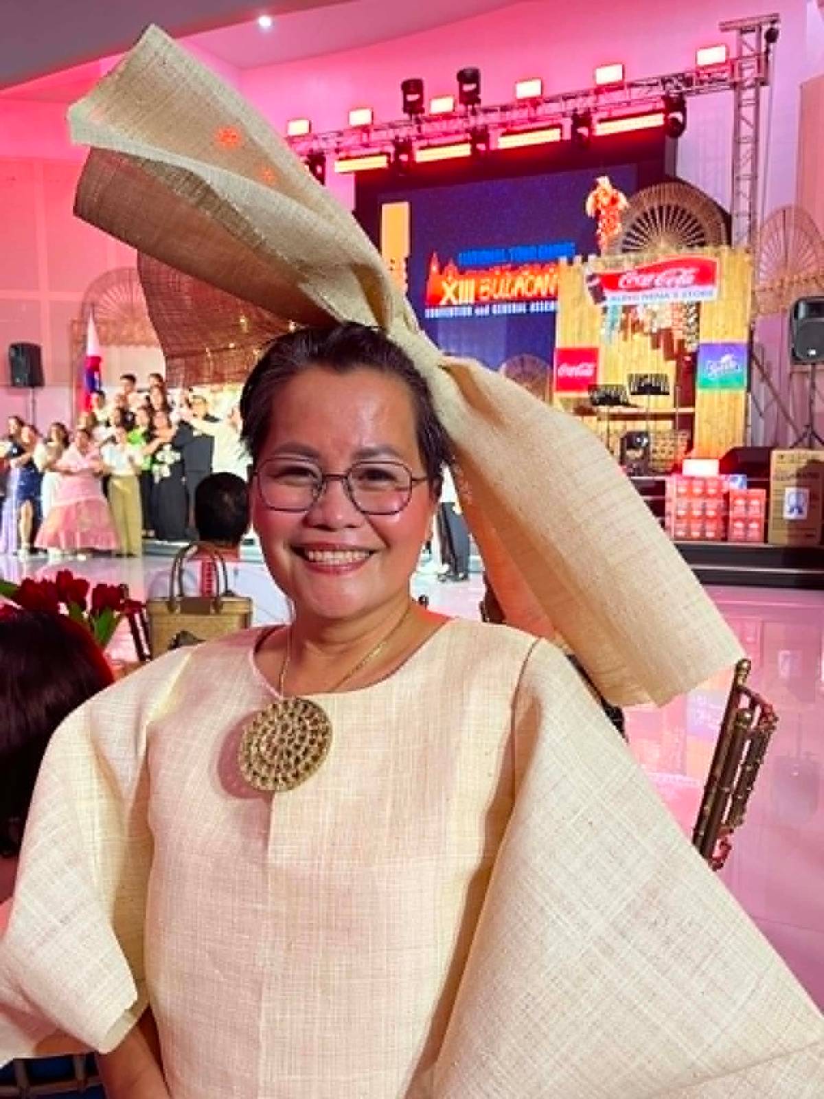 A delegate from Bohol wearing saguran (woven buri leaves) attire.