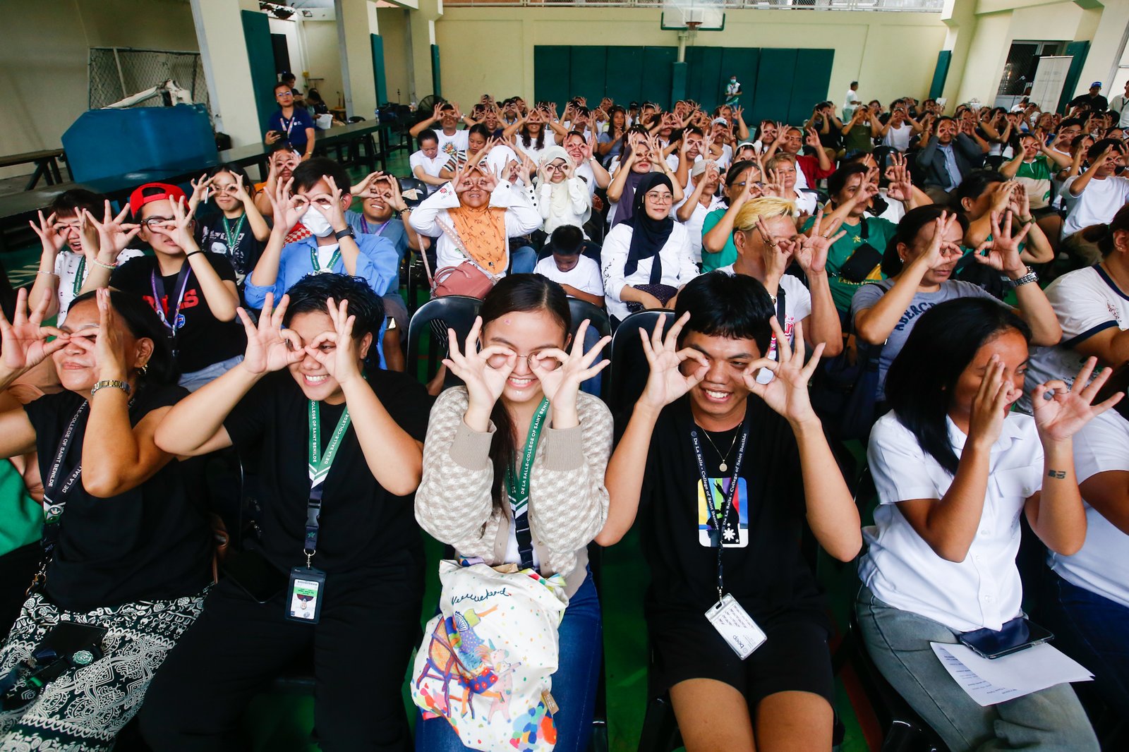 Students, workers, civil society groups, and community leaders gather for a public forum at the Sandejas Gym in De La Salle-College of Saint Benilde (DLS-CSB), Manila on 23 June 2026. Organized by Bantay Senado, the Center for Social Action, and the School of Diplomacy and Governance, the forum aims to provide local leaders with a shared, accurate, and process-based understanding of the current impeachment proceedings and upcoming developments.