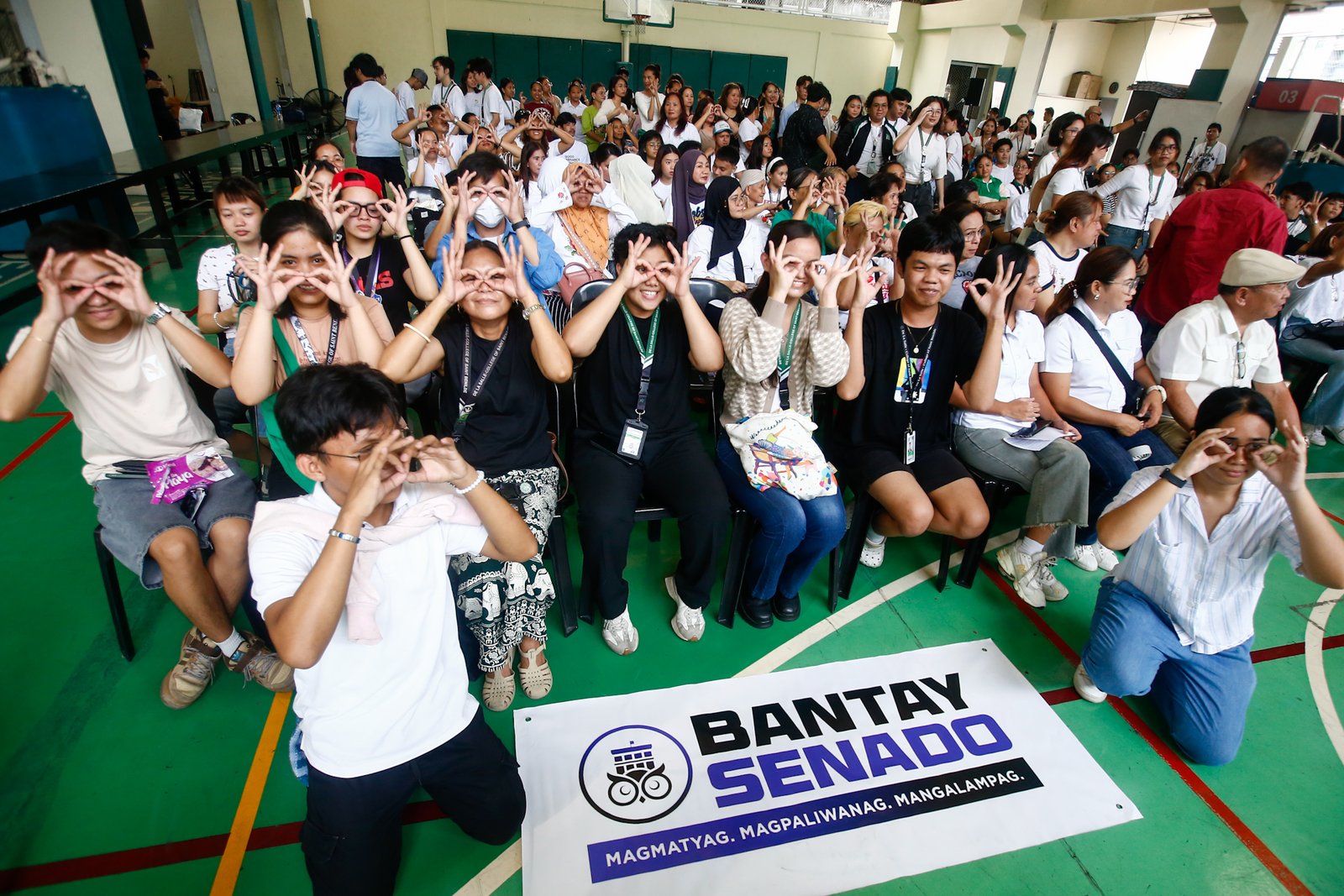 Students, workers, civil society groups, and community leaders gather for a public forum at the Sandejas Gym in De La Salle-College of Saint Benilde (DLS-CSB), Manila on 23 June 2026. Organized by Bantay Senado, the Center for Social Action, and the School of Diplomacy and Governance, the forum aims to provide local leaders with a shared, accurate, and process-based understanding of the current impeachment proceedings and upcoming developments.