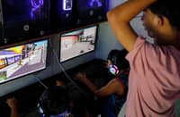 CHILDREN play online games at a computer shop in Manila. The government has raised concerns over the potential effects of prolonged exposure to violent online games, warning that such content may influence the behavior of minors.