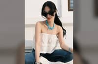 HEART Evangelista makes a striking statement in a turquoise collar necklace.