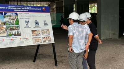 President Ferdinand Marcos Jr. and Public Works and Highways Secretary Vince Dizon check the plan of the National Kidney and Transplant Institute Legacy Building on East Avenue in Diliman, Quezon City.