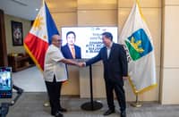 GSIS president and general manager Wick Veloso (left) and chairperson Ricardo Blancaflor share a handshake following the latter’s welcome as the new GSIS Board chairperson.