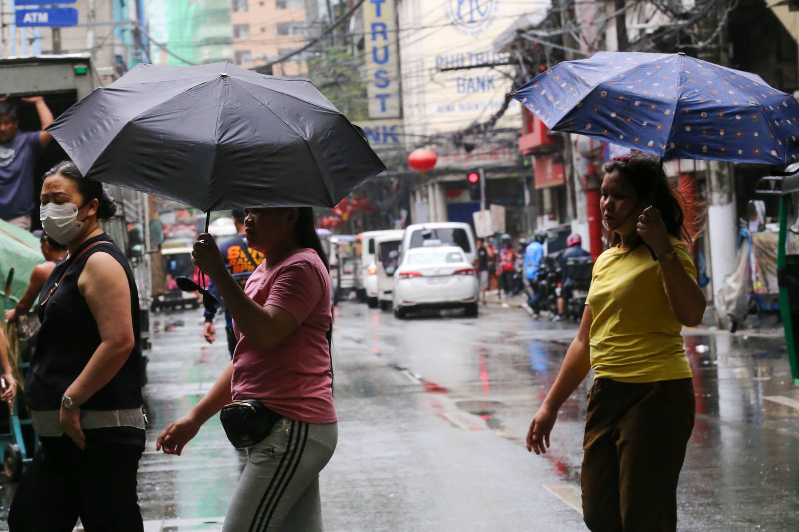 Umbrellas and raincoats are out along Soler Street in Manila on 27 June 2026 as the southwest monsoon, or "Habagat," and the Intertropical Convergence Zone (ITCZ) bring rains across several parts of the country. According to PAGASA, Habagat is expected to bring cloudy skies with scattered rain showers and thunderstorms over Metro Manila.