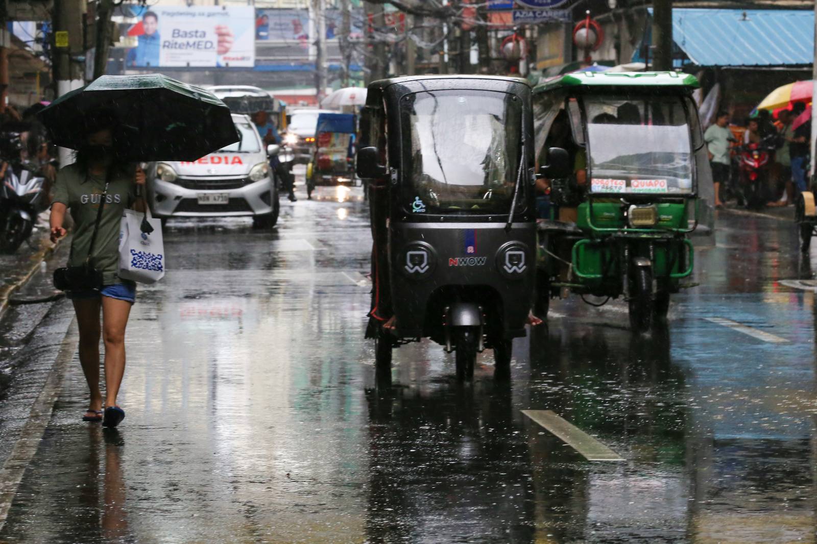 Umbrellas and raincoats are out along Soler Street in Manila on 27 June 2026 as the southwest monsoon, or "Habagat," and the Intertropical Convergence Zone (ITCZ) bring rains across several parts of the country. According to PAGASA, Habagat is expected to bring cloudy skies with scattered rain showers and thunderstorms over Metro Manila.