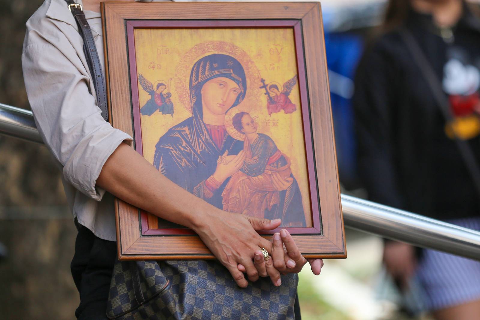 Catholic devotees offer candles and prayers at the Baclaran Church in Paranaque City on 27 June 2026, as the community celebrates the Feast of Mother of Perpetual Help.